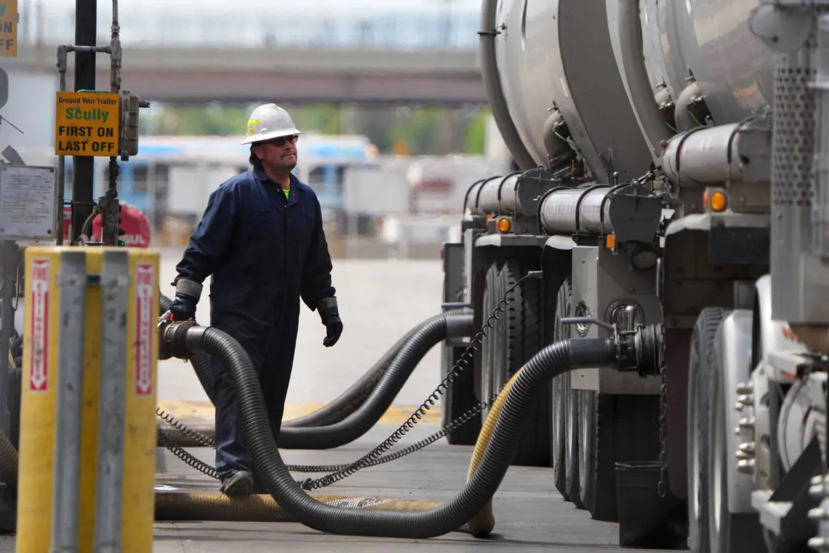 A driver unloads raw crude oil from his tanker to process into gas at Marathon Refinery in Salt Lake City, Utah, on May 24, 2022. (George Frey/Getty Images)