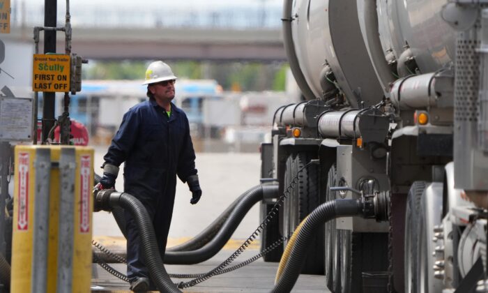 A driver unloads raw crude oil from his tanker to process into gas at Marathon Refinery in Salt Lake City, Utah, on May 24, 2022. (George Frey/Getty Images)