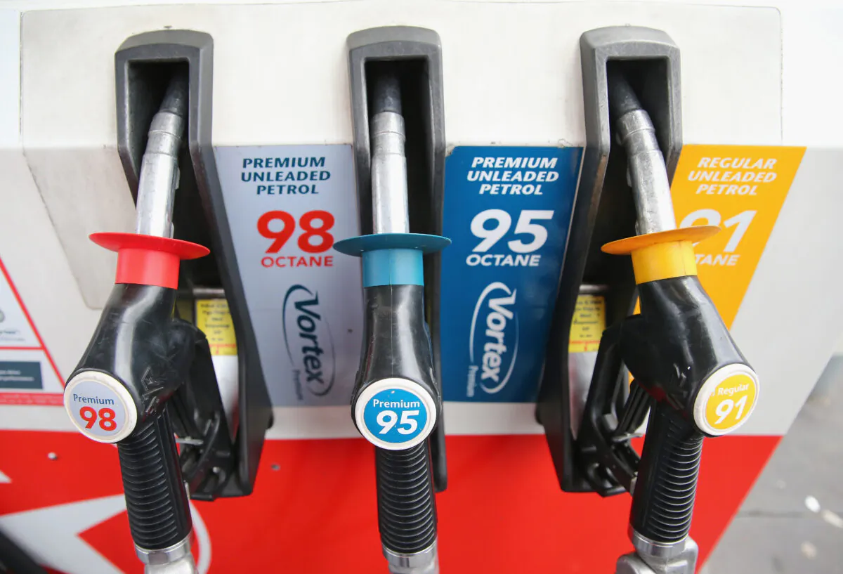 Fuel nozzles rest in a fuel dispenser at a petrol station in Melbourne, Australia, on July 23, 2013. (Scott Barbour/Getty Images)