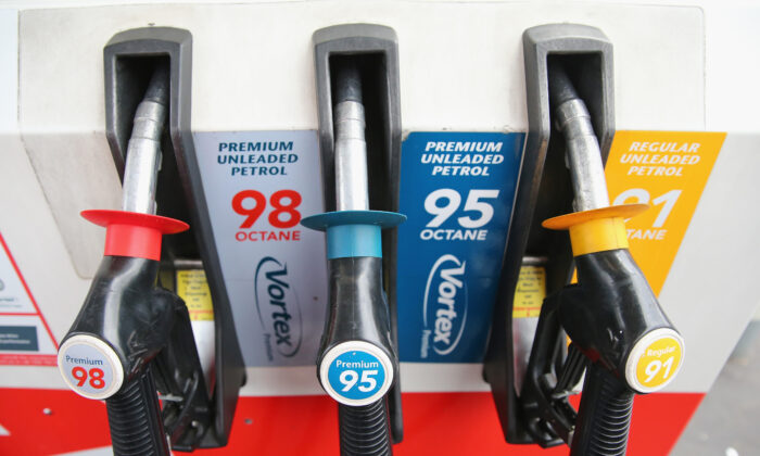 Fuel nozzles rest in a fuel dispenser at a petrol station in Melbourne, Australia, on July 23, 2013. (Scott Barbour/Getty Images)