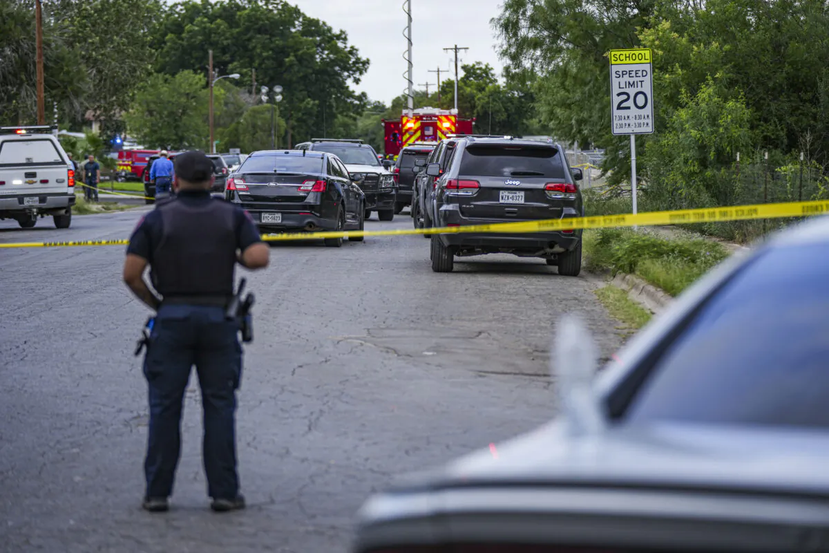Police cordon off the streets around Robb Elementary School after a mass shooting, in Uvalde, Texas, on May 24, 2022. (Charlotte Cuthbertson/The Epoch Times)