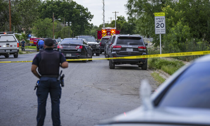 Police cordon off the streets around Robb Elementary School after a mass shooting, in Uvalde, Texas, on May 24, 2022. (Charlotte Cuthbertson/The Epoch Times)