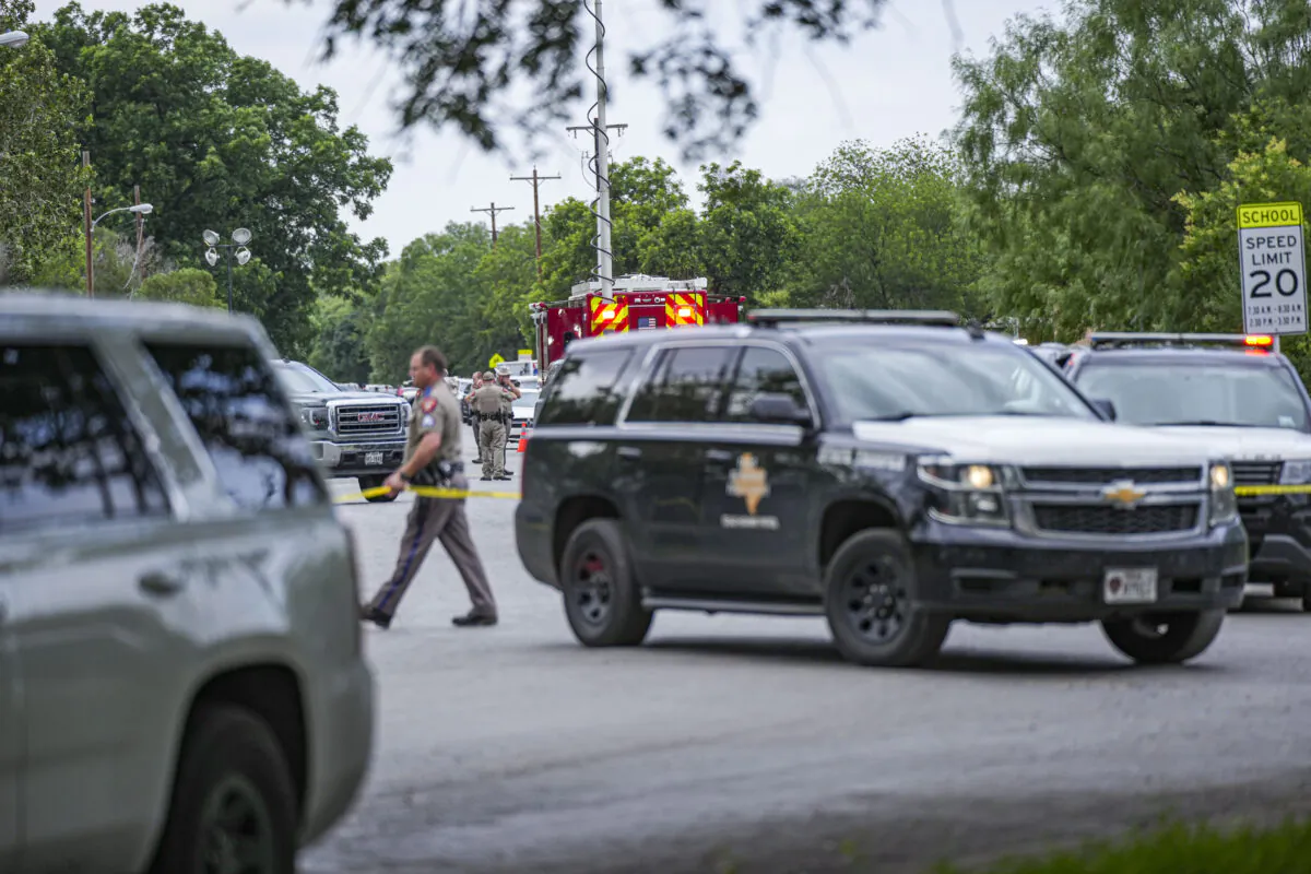 Police cordon off the streets around Robb Elementary School after a mass shooting, in Uvalde, Texas, on May 24, 2022. (Charlotte Cuthbertson/The Epoch Times)