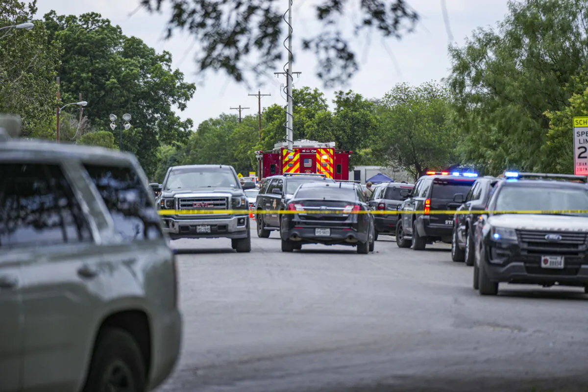 Police cordon off the streets around Robb Elementary School after a mass shooting, in Uvalde, Texas, on May 24, 2022. (Charlotte Cuthbertson/The Epoch Times)