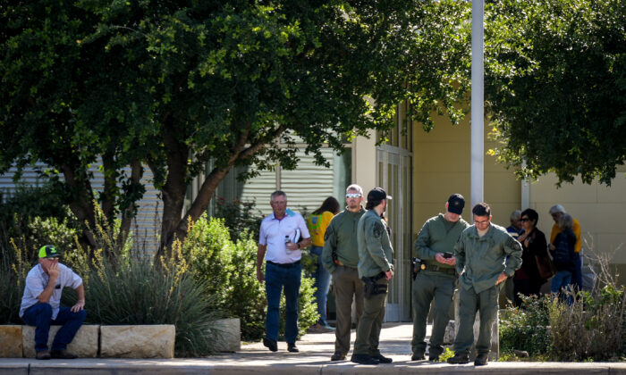 Law enforcement officials at the Uvalde Civic Center, which is operating as a grief counseling location for community members affected by the mass shooting at Robb Elementary School the day prior, in Uvalde, Texas, on May 24, 2022. (Charlotte Cuthbertson/The Epoch Times)