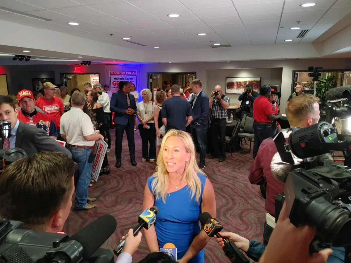 Marjorie Taylor Greene speaks to the media at a watch party in Rome, Georgia, after winning the District 14 GOP primary on May 24, 2022. (Jeff Louderback/The Epoch Times)