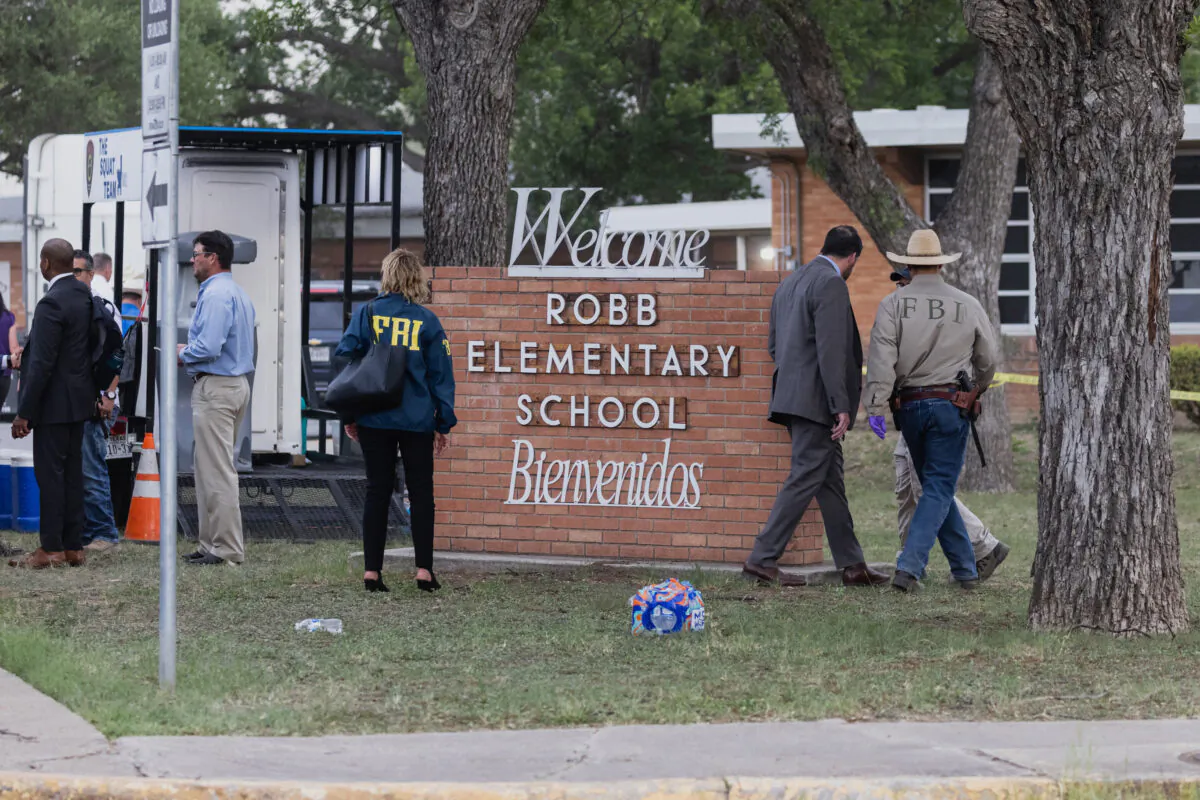 Law enforcement officers work the scene after a mass shooting at Robb Elementary School in Uvalde, Texas, on May 24, 2022. (Jordan Vonderhaar/Getty Images)