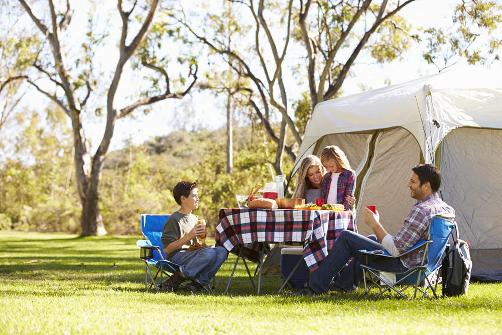 You can find plenty of creative ways to have a great time with the people you love on a budget, from a camping trip to a staycation in your own city. (Monkey Business Images/Shutterstock)
