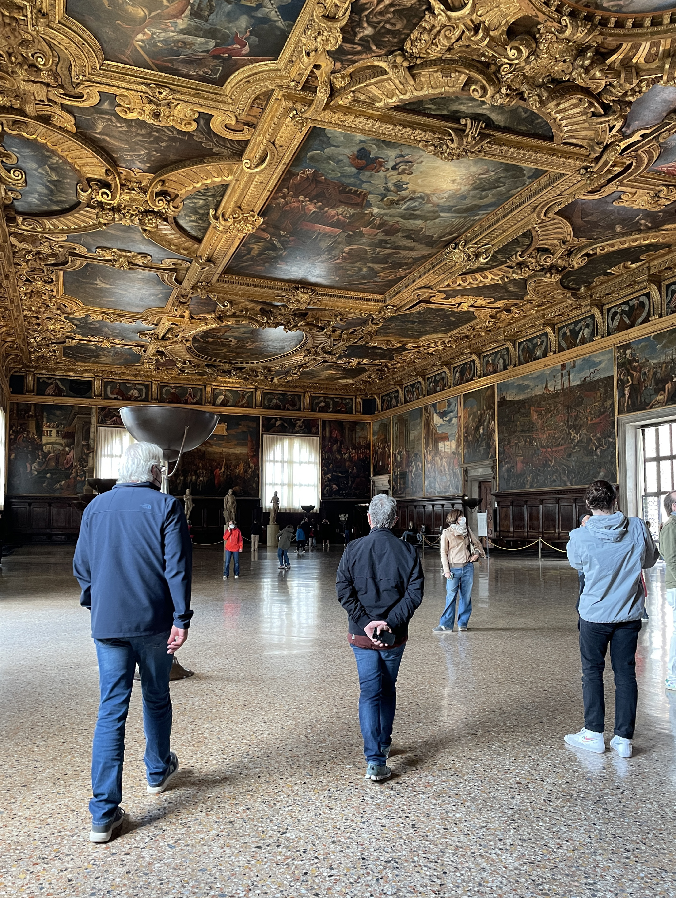 Guests absorb the impact of powerful gold friezes above the Great Council's meeting room in Venice's famed Doge's Palace. 