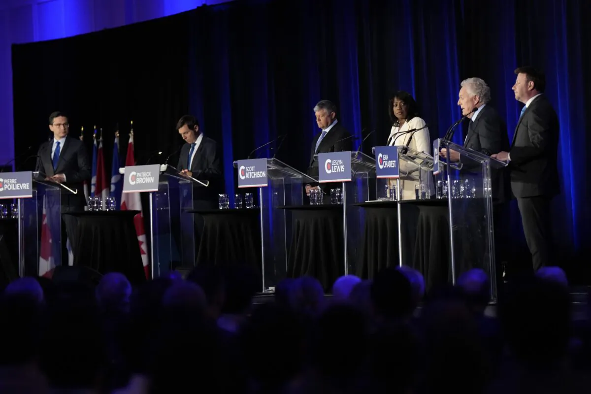 Conservative leadership hopefuls (L-R) Pierre Poilievre, Patrick Brown, Scott Aitchison, Leslyn Lewis, Jean Charest and Roman Baber take part in the Conservative Party of Canada French-language leadership debate in Laval, Quebec on May 25, 2022. (The Canadian Press/Ryan Remiorz)