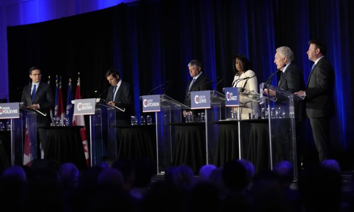Conservative leadership hopefuls (L-R) Pierre Poilievre, Patrick Brown, Scott Aitchison, Leslyn Lewis, Jean Charest and Roman Baber take part in the Conservative Party of Canada French-language leadership debate in Laval, Quebec on May 25, 2022. (The Canadian Press/Ryan Remiorz)