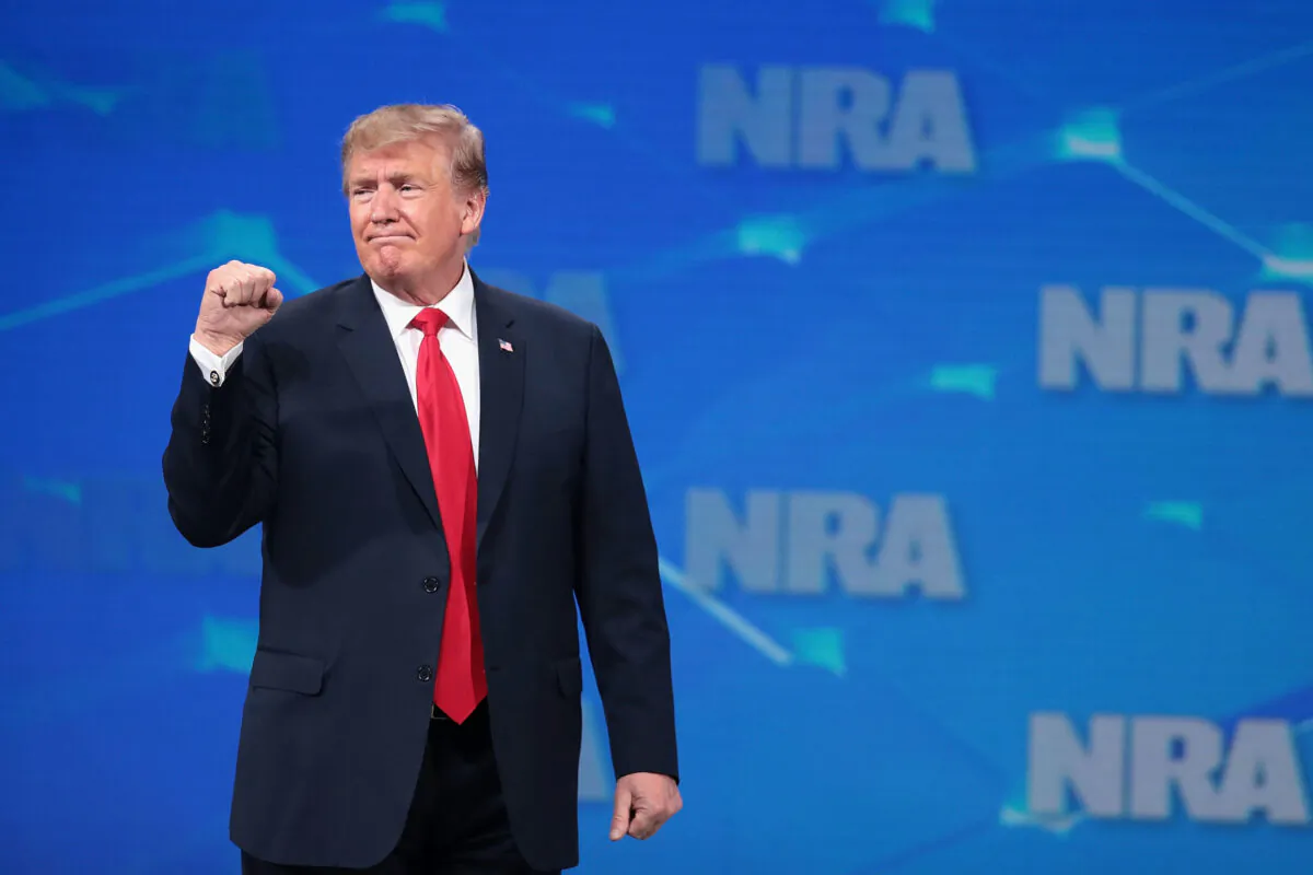 President Donald Trump gestures to guests at the NRA-ILA Leadership Forum at the 148th NRA Annual Meetings & Exhibits in Indianapolis, Indiana, on April 26, 2019. (Scott Olson/Getty Images)