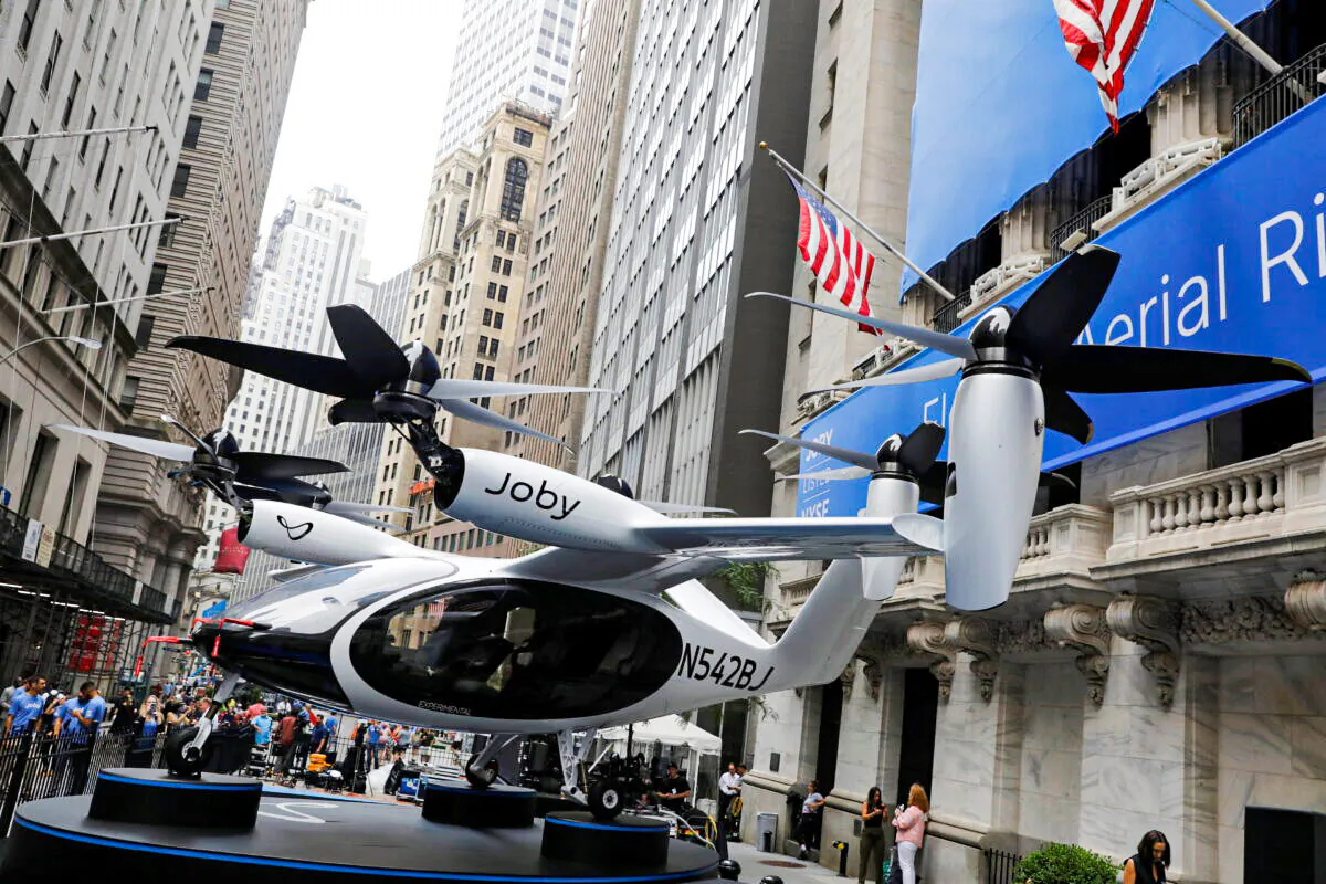 A Joby Aviation Air Taxi outside of the New York Stock Exchange ahead of their listing in Manhattan, New York, on Aug. 11, 2021. (Andrew Kelly/Reuters)