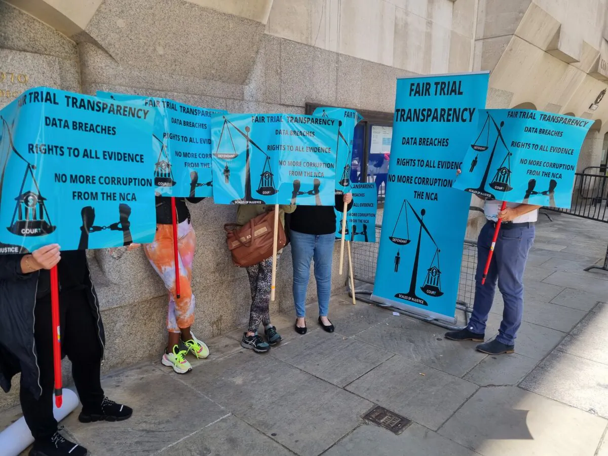 Campaigners against the National Crime Agency's use of data hacked from EncroChat by French police protest outside the Old Bailey in London on May 27, 2022. (Chris Summers/The Epoch Times) 