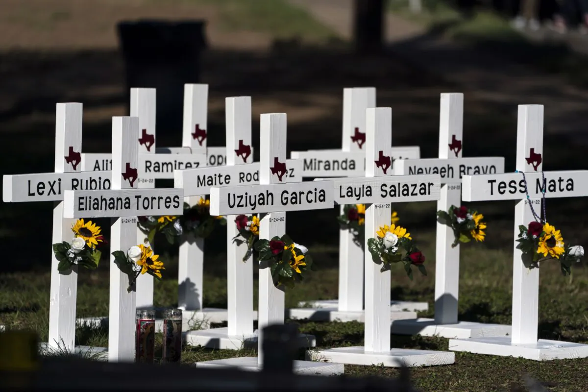 Crosses with the names of Tuesday's shooting victims are placed outside Robb Elementary School in Uvalde, Texas, on May 26, 2022. (Jae C. Hong/AP Photo)