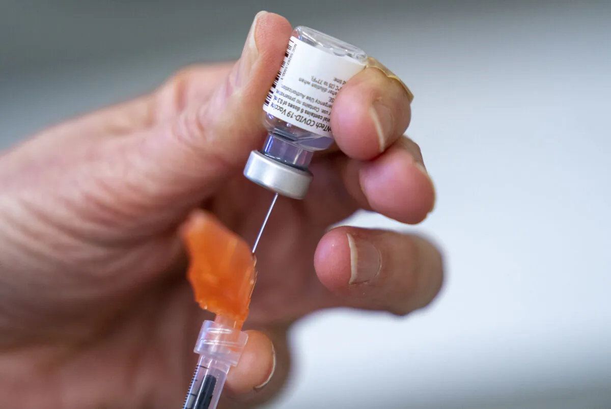 A syringe is loaded with COVID-19 vaccine at a vaccination clinic run by Vancouver Coastal Health, in Richmond, B.C., on April 10, 2021. (The Canadian Press/Jonathan Hayward)