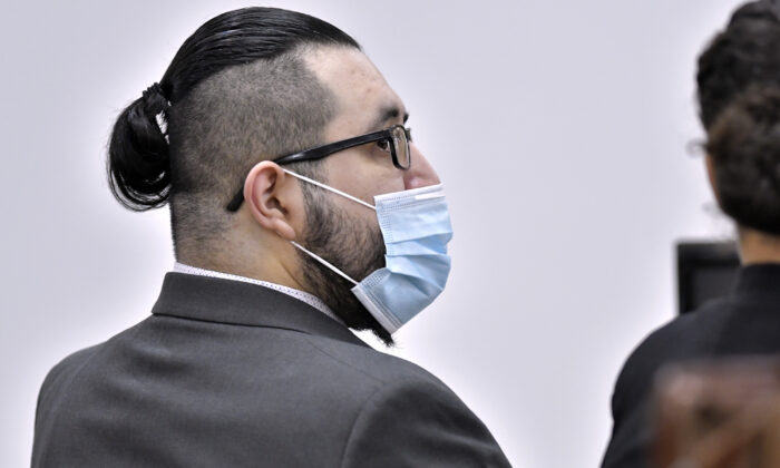 Armando Barron speaks with a member of his defense team during the first day of his trial at Cheshire County Superior Court in Keene, N.H., on May 17, 2022. (Josh Reynolds/AP Photo)