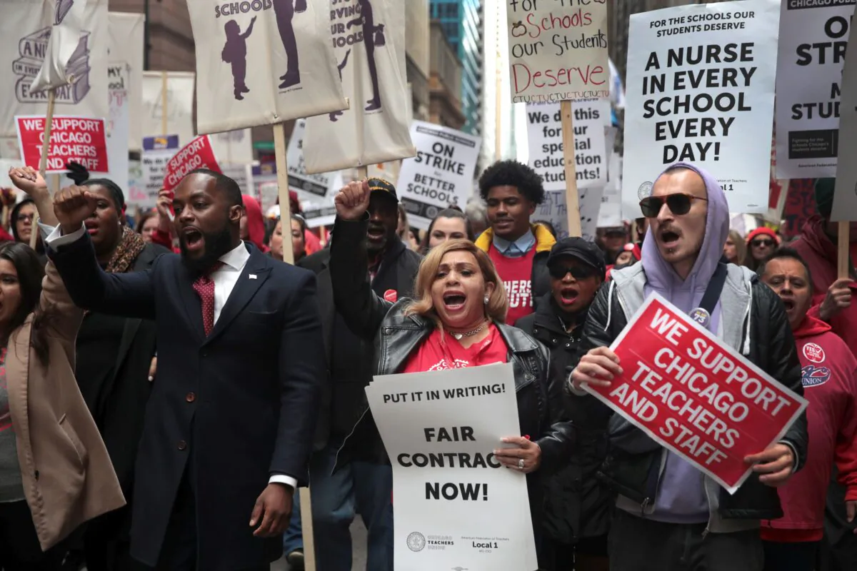 Florida Gov. Ron DeSantis proposed teacher pay hikes, a teachers bill of rights and new restrictions on teachers' unions on January 23, 2022 in a speech in Jacksonville, Fla. Here, striking Chicago school teachers and their supporters demonstrate on Oct. 17, 2019. (Scott Olson/Getty Images)