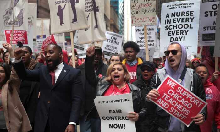 Florida Gov. Ron DeSantis proposed teacher pay hikes, a teachers bill of rights and new restrictions on teachers' unions on January 23, 2022 in a speech in Jacksonville, Fla. Here, striking Chicago school teachers and their supporters demonstrate on Oct. 17, 2019. (Scott Olson/Getty Images)