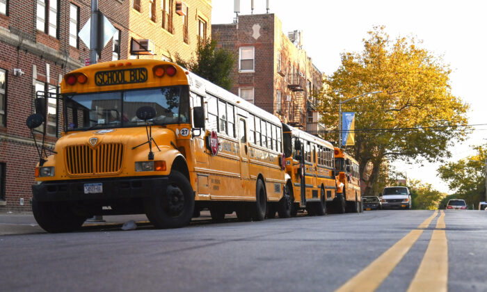 School buses are seen parked in the Brooklyn neighborhood of Borough Park in New York City on Oct. 6, 2020. (ANGELA WEISS/AFP via Getty Images)