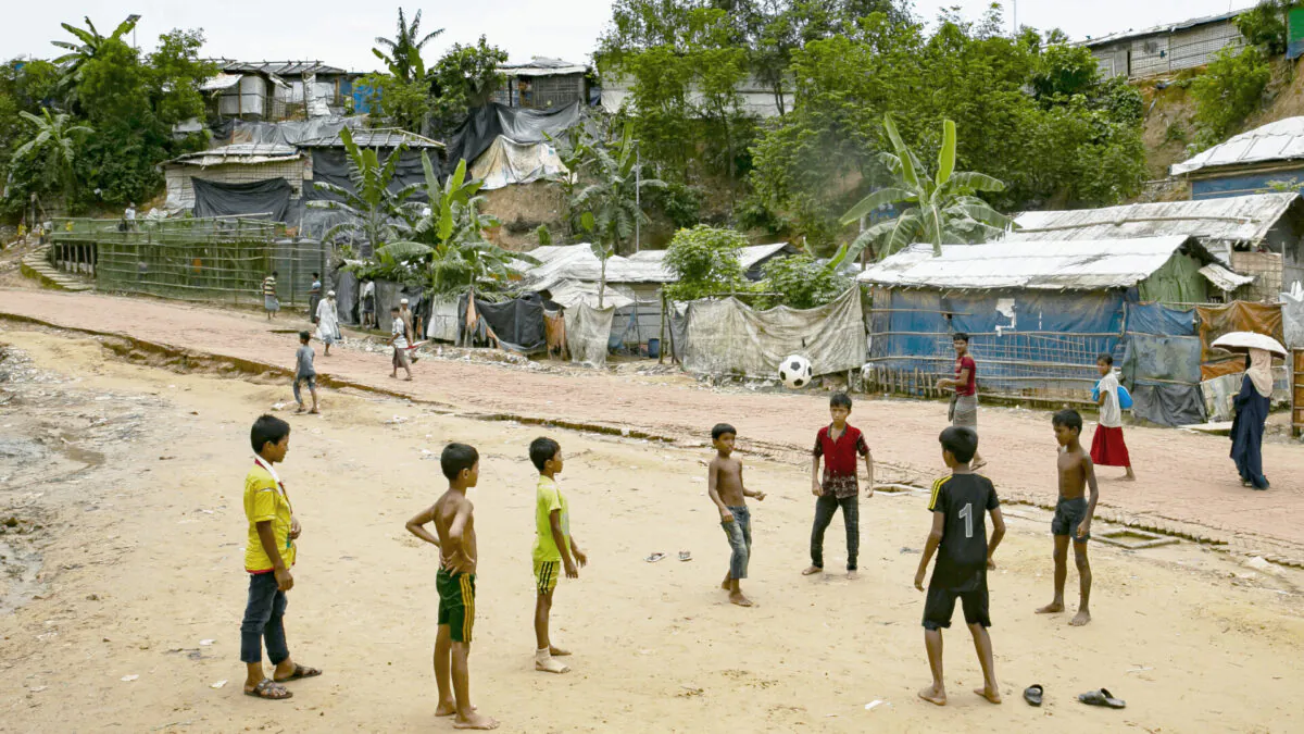 Children play football in a Rohingya refugee camp on August 11, 2021 in Cox's Bazar, Bangladesh. (Allison Joyce/Getty Images)