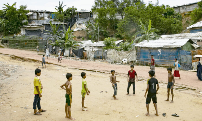 Children play football in a Rohingya refugee camp on August 11, 2021 in Cox's Bazar, Bangladesh. (Allison Joyce/Getty Images)
