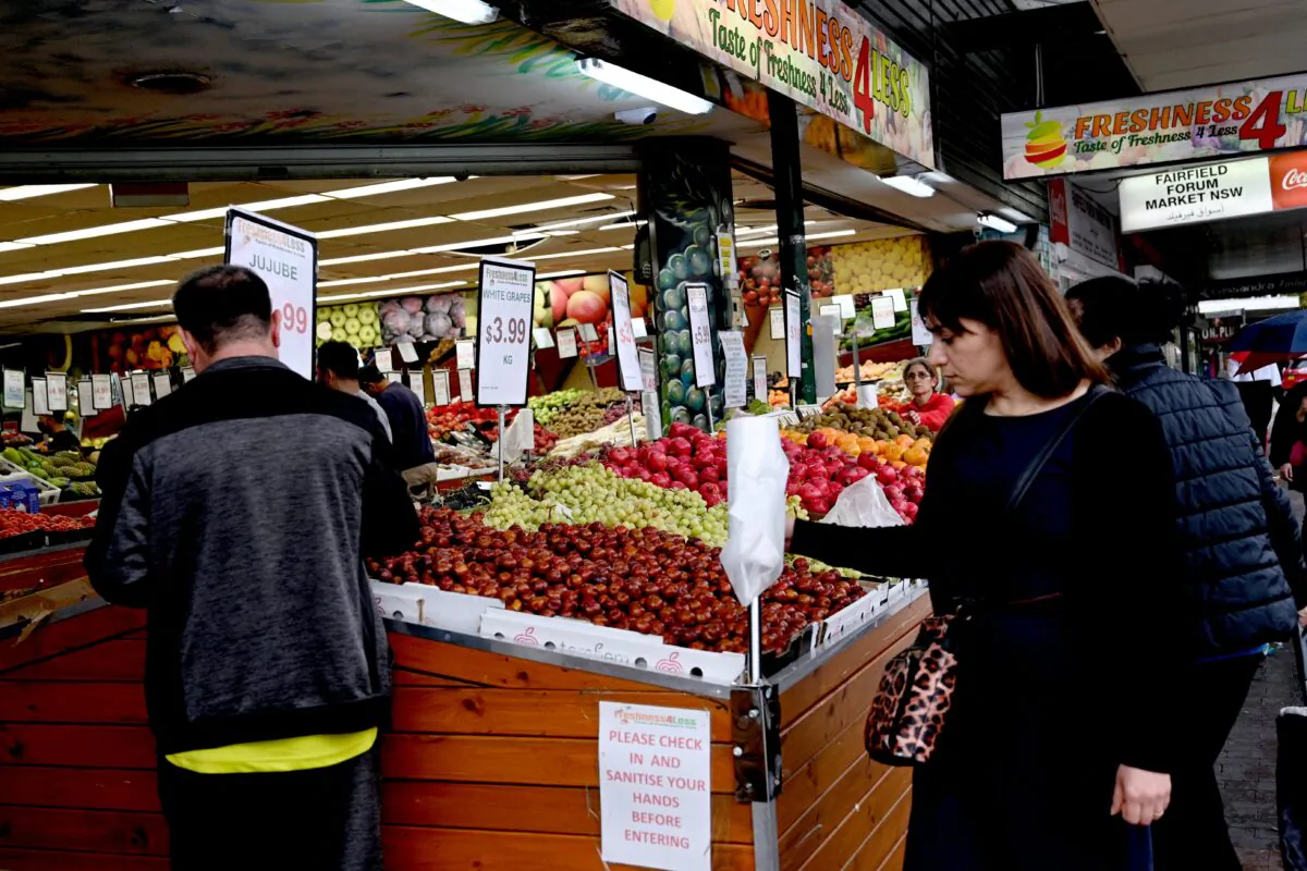 People shop at a market in a suburb of western Sydney, Australia, on April 27, 2022. (Saeed Khan/AFP via Getty Images)