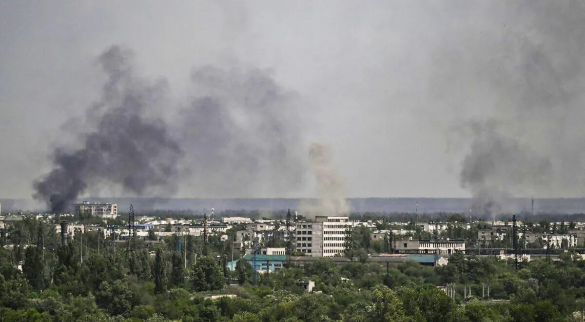 Smoke and dirt rise from the city of Sievierodonetsk, during shelling in the eastern Ukrainian region of Donbass, on May 26, 2022. (Aris Messinis/AFP via Getty Images)