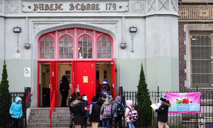 Children line up as they enter a public school in New York City on Dec. 7, 2020. (Michael M. Santiago/Getty Images)
