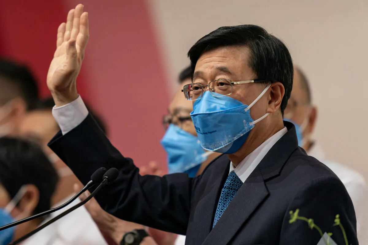 Hong Kong Chief Executive-elect John Lee Ka-chiu waves during a press conference at the Exhibition and Convention Centre in Hong Kong on May 8, 2022. (Anthony Kwan/Getty Images)