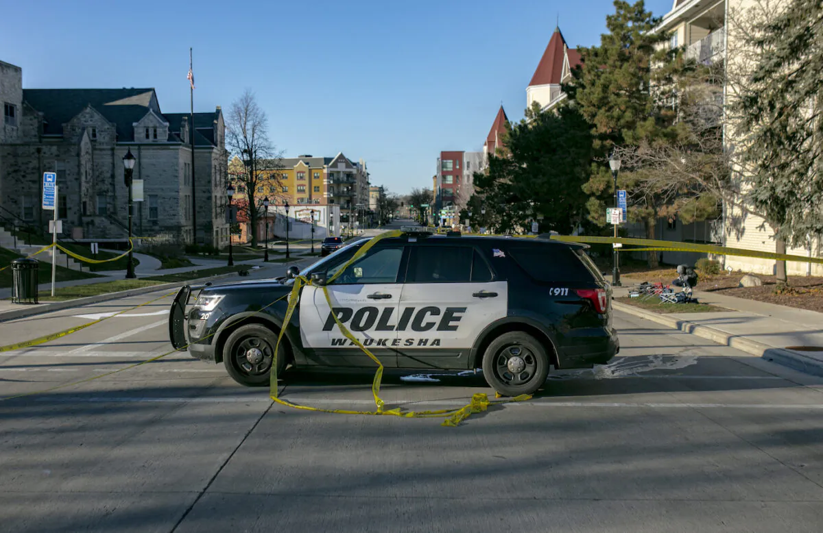 A police vehicle blocks off a road entrance in downtown Waukesha, Wisconsin, on Nov. 22, 2021. (Jim Vondruska/Getty Images)