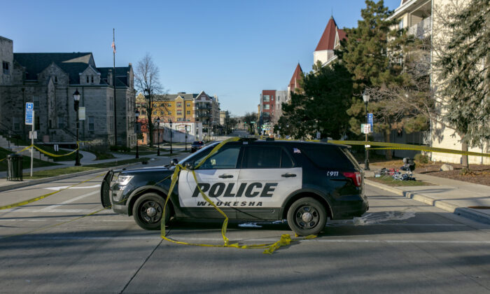 A police vehicle blocks off a road entrance in downtown Waukesha, Wisconsin, on Nov. 22, 2021. (Jim Vondruska/Getty Images)