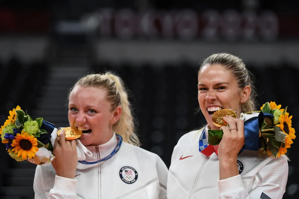 USA's Jordyn Poulter (L) and Andrea Drews pose with their gold medals during the women's volleyball victory ceremony during the Tokyo 2020 Olympic Games at Ariake Arena in Tokyo on August 8, 2021. (Yuri Cortez/AFP via Getty Images)