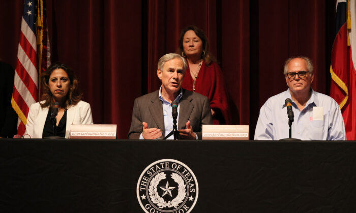 Texas Gov. Greg Abbott speaks during a press conference about the mass shooting as he sits with Christina Mitchell Busbee, 38th Judicial District Attorney and Mayor Don McLaughlin at Uvalde High School in Uvalde, Texas, on May 27, 2022. (Michael M. Santiago/Getty Images)