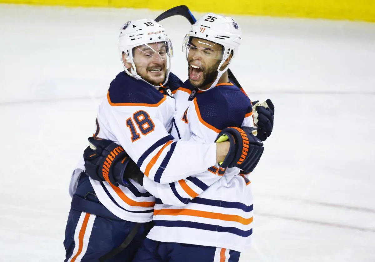 Edmonton Oilers winger Zach Hyman (L) celebrates his goal with teammate Darnell Nurse during second period NHL second-round playoff hockey action against the Calgary Flames in Calgary, on May 26, 2022. (The Canadian Press/Jeff McIntosh)