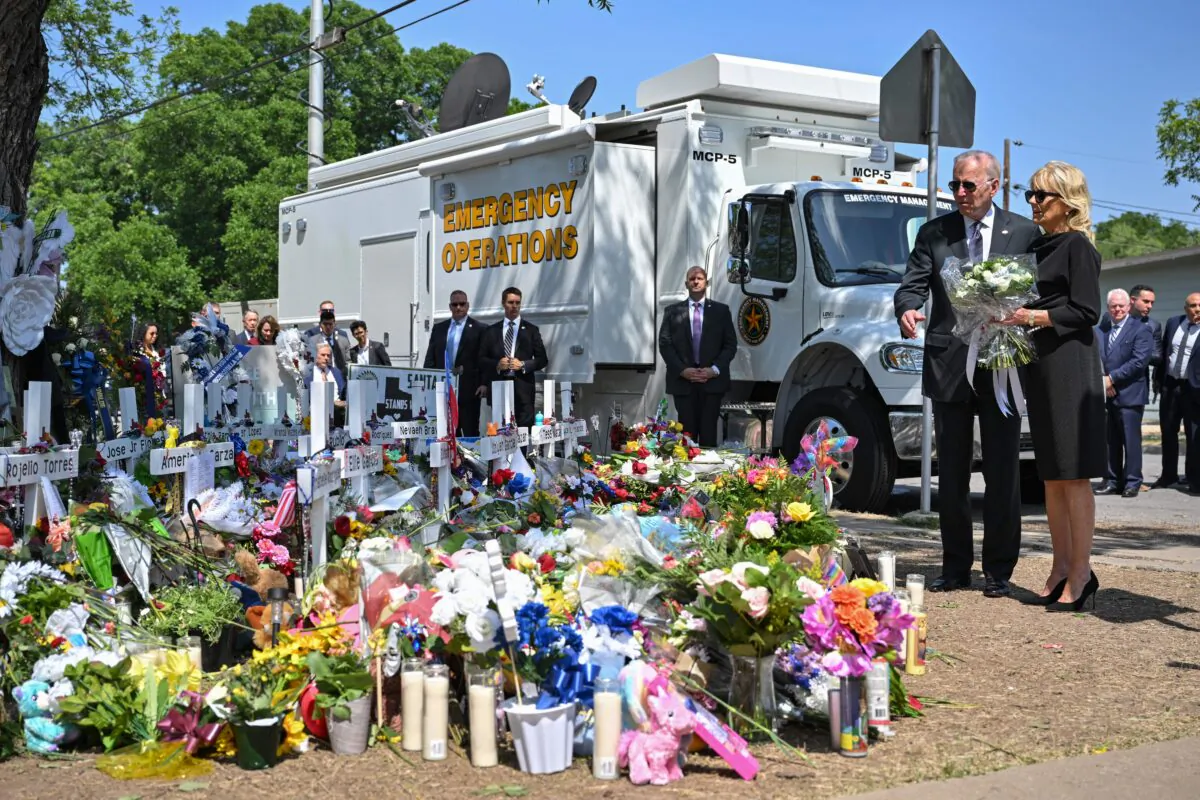 President Joe Biden and First Lady Jill Biden pay their respects at a makeshift memorial outside of Robb Elementary School in Uvalde, Texas on May 29, 2022. (Mandel Ngan/AFP via Getty Images)