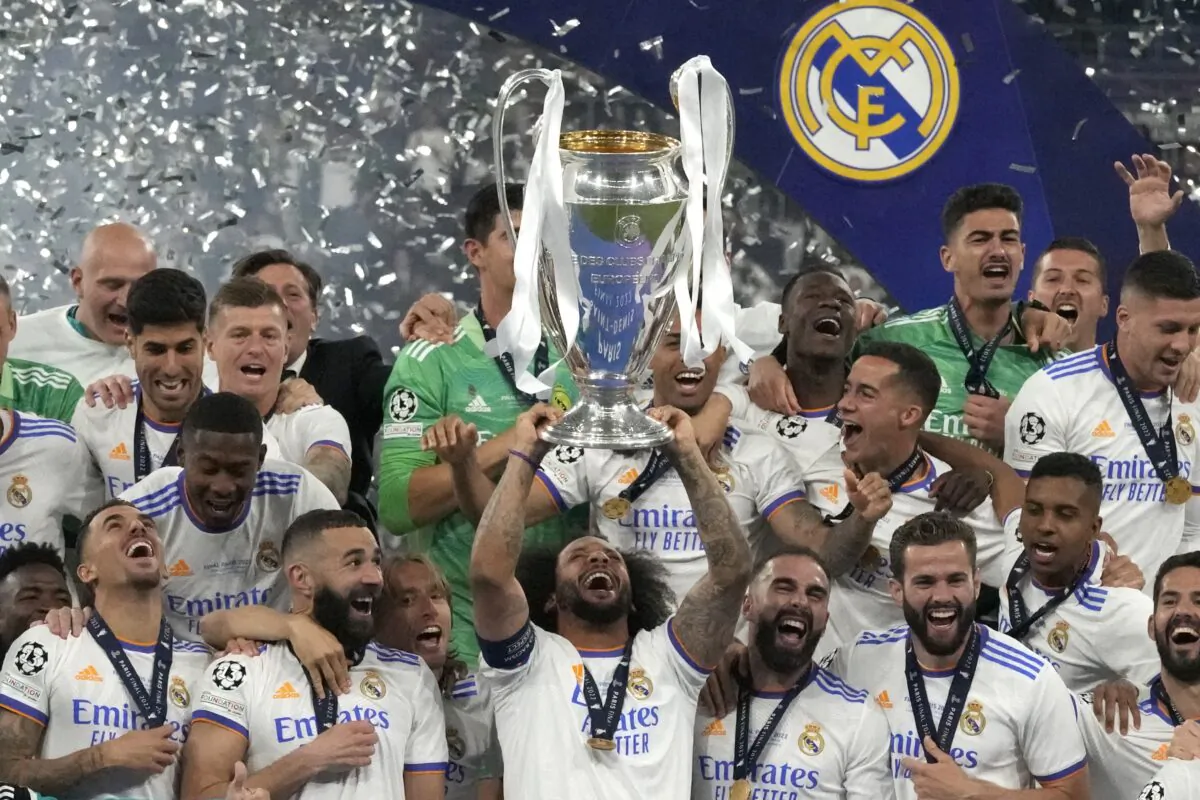 Real Madrid's Marcelo lifts the trophy as players celebrate winning the Champions League final soccer match between Liverpool and Real Madrid at the Stade de France in Saint Denis near Paris, on May 28, 2022. (Frank Augstein/AP Photo)