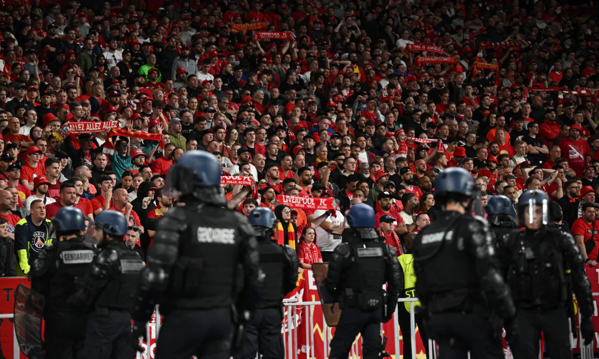 Police in front of the Liverpool fans after the Champions League final soccer match between Liverpool and Real Madrid at the Stade de France in Saint Denis near Paris on May 28, 2022. (Dylan Martinez/Reuters)