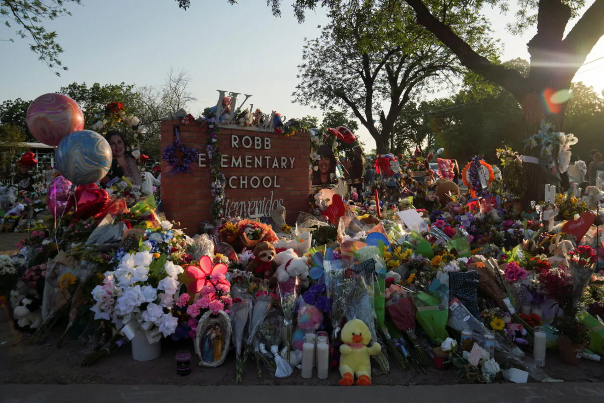 Flowers, toys, and other objects to remember the victims of the deadliest U.S. school shooting in nearly a decade resulting in the death of 19 children and two teachers, are seen at a memorial at Robb Elementary School in Uvalde, Texas, on May 30, 2022. (Veronica G. Cardenas/Reuters)