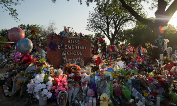 Flowers, toys, and other objects to remember the victims of the deadliest U.S. school shooting in nearly a decade resulting in the death of 19 children and two teachers, are seen at a memorial at Robb Elementary School in Uvalde, Texas, on May 30, 2022. (Veronica G. Cardenas/Reuters)