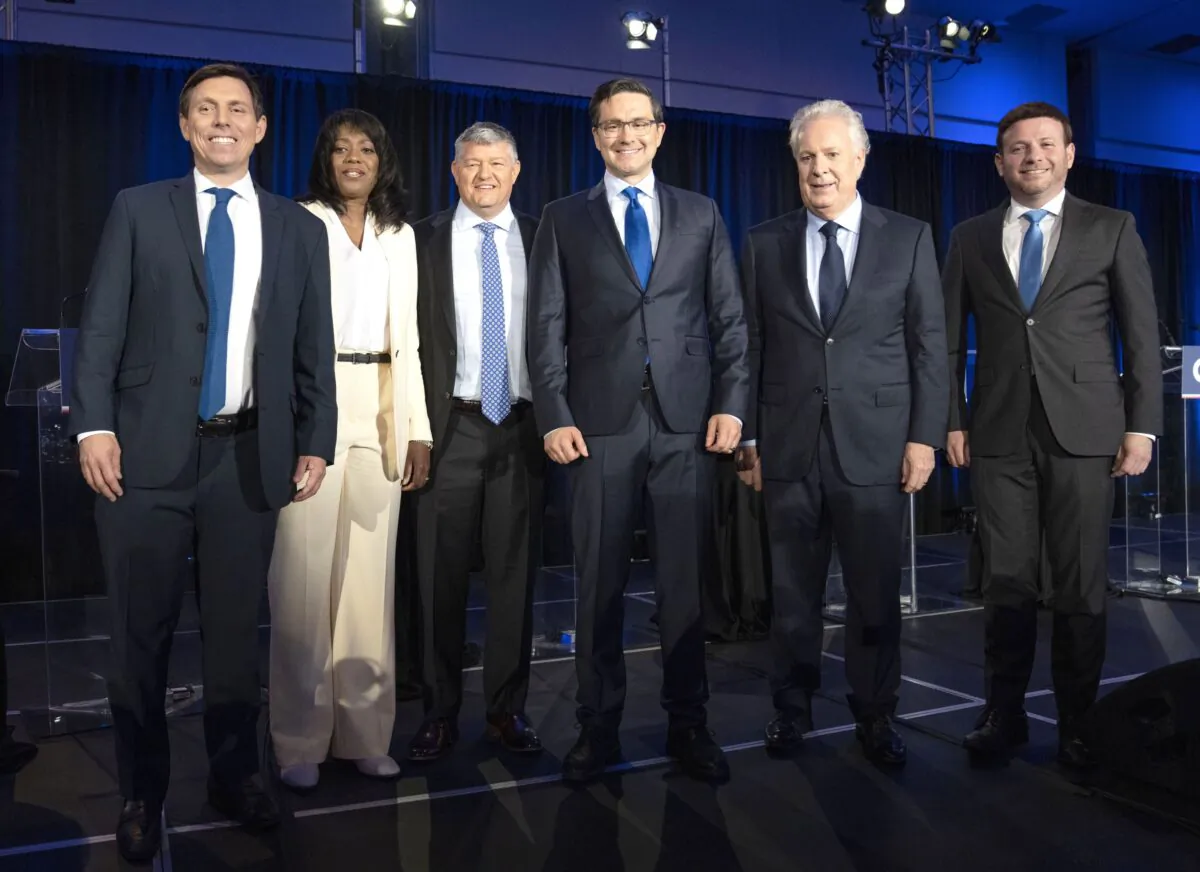 (L-R) Candidates Patrick Brown, Leslyn Lewis, Scott Aitchison, Pierre Poilievre, Jean Charest, and Roman Baber, pose for photos after the French-language Conservative Leadership debate on May 25, 2022 in Laval, Que. (The Canadian Press/Ryan Remiorz)