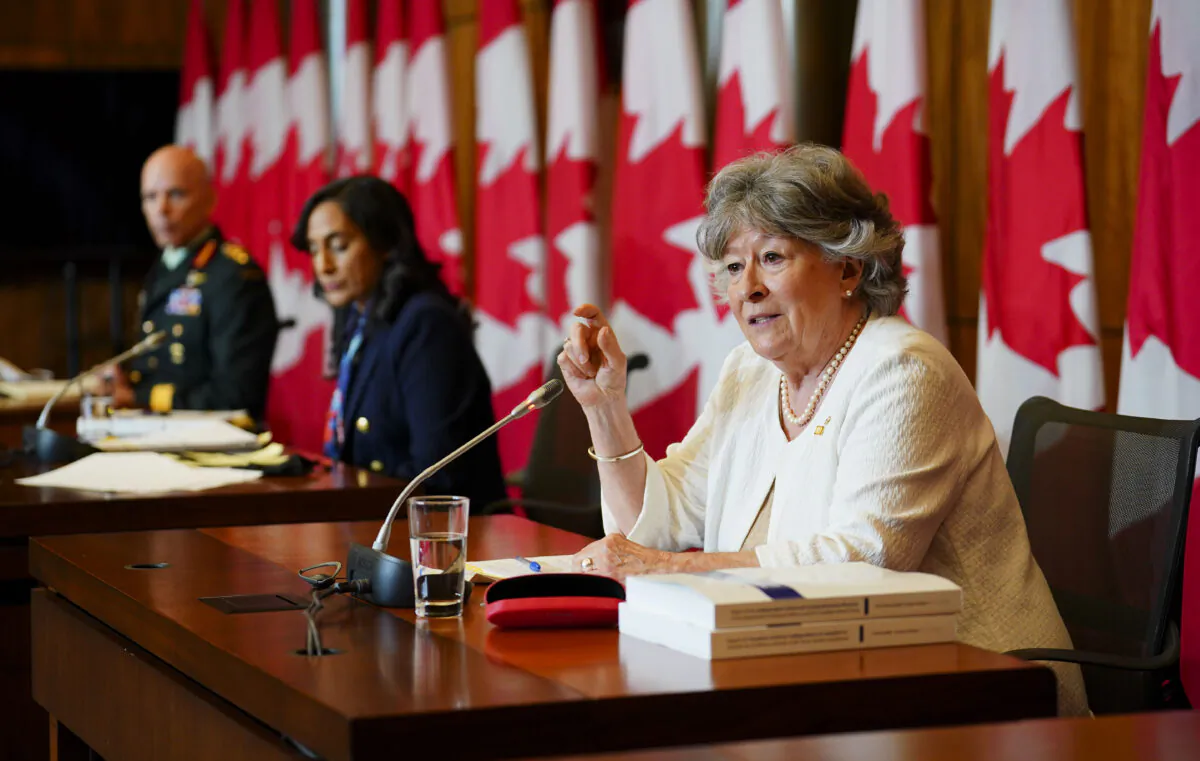Former Supreme Court Justice Louise Arbour (R) and Minister of National Defence Anita Anand (C) release the final report of the Independent External Comprehensive Review into Sexual Misconduct and Sexual Harassment in the Department of National Defence and the Canadian Armed Forces in Ottawa on May 30, 2022. On the left is Chief of the Defence Staff General Wayne Eyre. (Sean Kilpatrick/The Canadian Press)