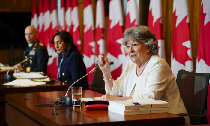 Former Supreme Court Justice Louise Arbour (R) and Minister of National Defence Anita Anand (C) release the final report of the Independent External Comprehensive Review into Sexual Misconduct and Sexual Harassment in the Department of National Defence and the Canadian Armed Forces in Ottawa on May 30, 2022. Also in attendance is Chief of the Defence Staff, General Wayne Eyre. (Sean Kilpatrick/The Canadian Press)