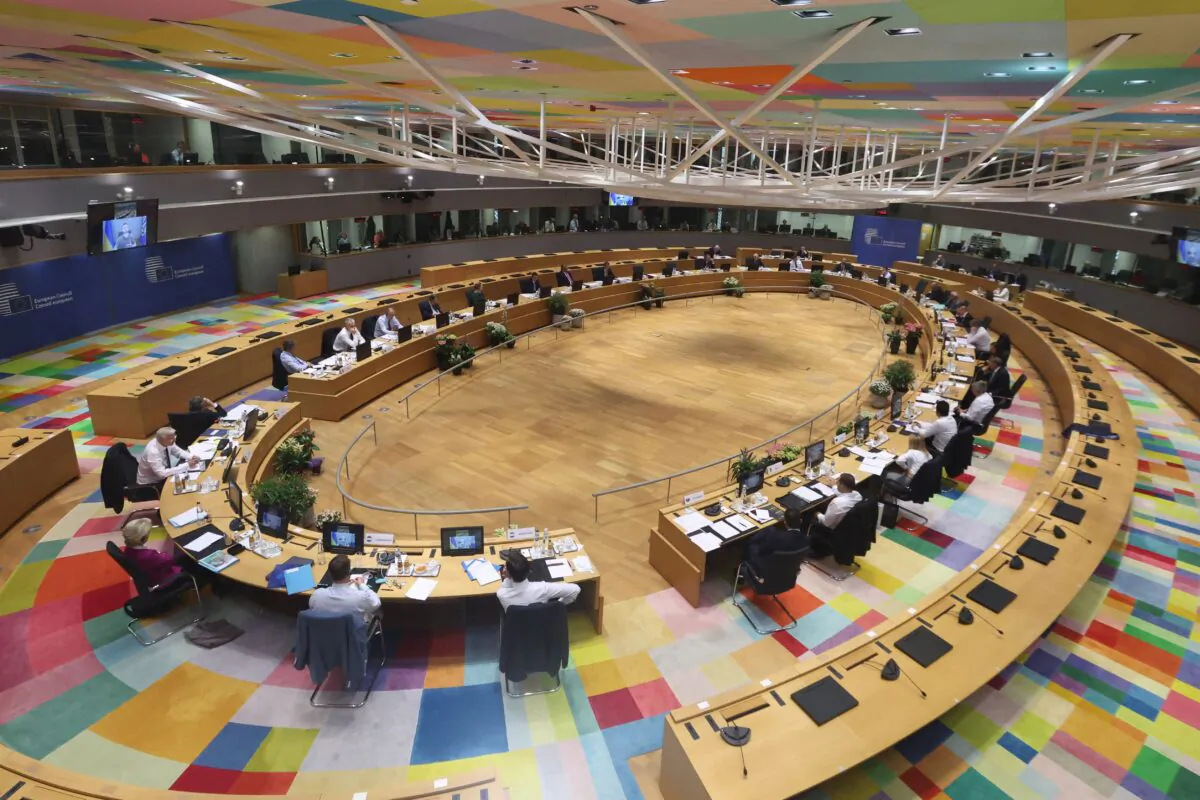 Ukrainian President Volodymyr Zelenskyy (on screen-L) speaks during a special meeting of the European Council at The European Council Building in Brussels on May 30, 2022. (Kenzo Tribouillard/Pool/AFP via Getty Images)