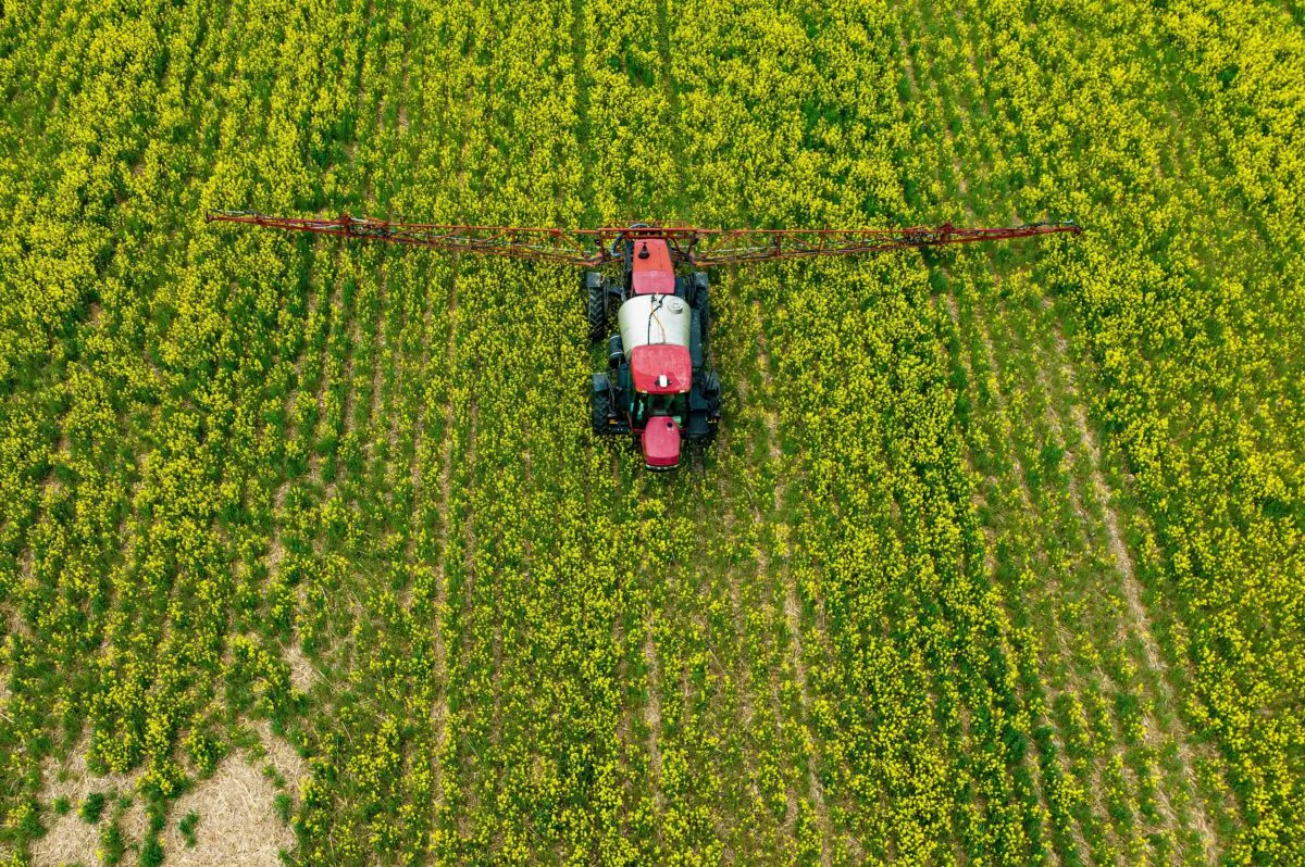 A farmer spreads pesticide on a field in Centreville, Md., on April 25, 2022. (Jim Watson/AFP via Getty Images)