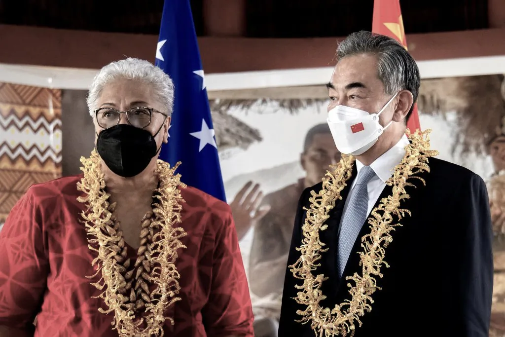 This picture released by the Samoa Observer on May 28, 2022 shows Chinese Foreign Minister Wang Yi (R) and Samoa Prime Minister Fiame Naomi Mataafa attending agreements signing ceremony between the two countries in Apia. (Vaitogi Asuisui Matafeo/Samoa Observer/AFP via Getty Images)