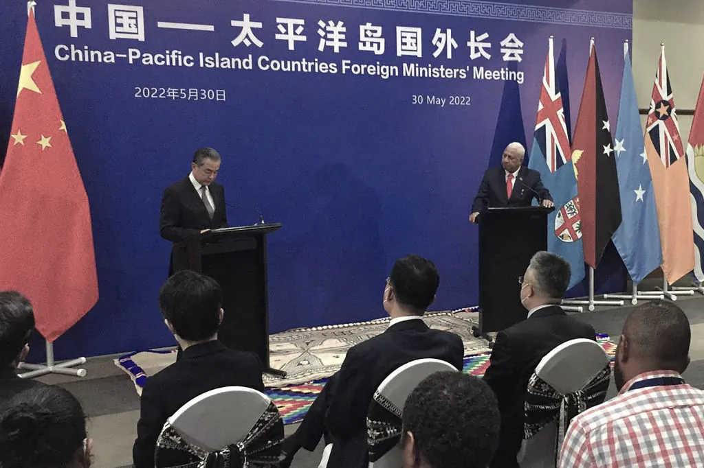 Visiting Chinese Foreign Minister Wang Yi (L) and Fijian Prime Minister Frank Bainimarama attend a joint press conference in Fiji's capital city Suva on May 30. (Leon Lord/AFP via Getty Images)