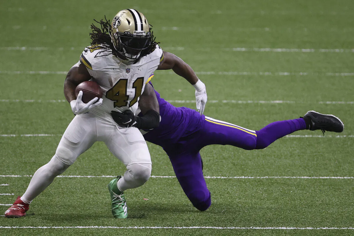 Alvin Kamara #41 of the New Orleans Saints makes a reception past Jeff Gladney #20 of the Minnesota Vikings during the fourth quarter at Mercedes-Benz Superdome in New Orleans, La., on Dec. 25, 2020. (Chris Graythen/Getty Images)