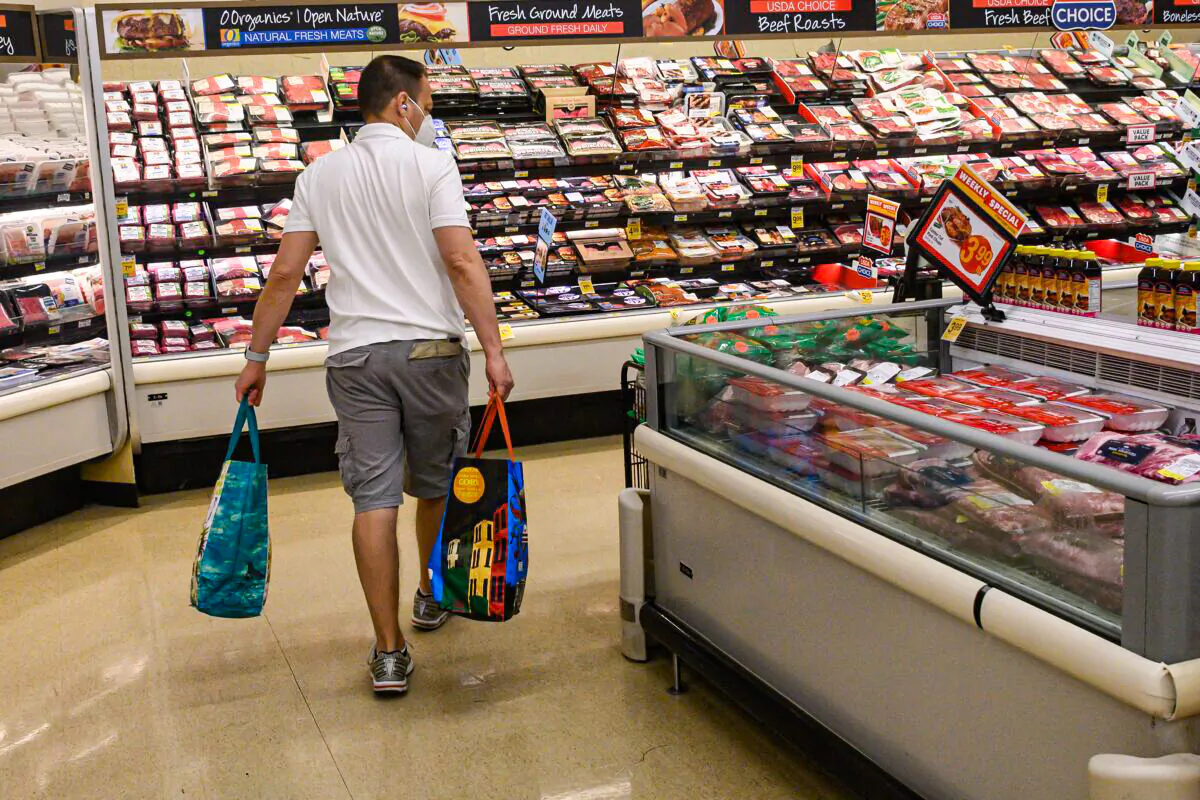 A person shops in a supermarket in Washington on May 26, 2022. (Nicholas Kamm/AFP via Getty Images)