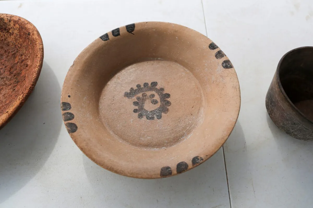 A pot is displayed after being discovered in the ruins of a Mayan site, called Xiol, after archaeologists have uncovered an ancient Mayan city filled with palaces, pyramids and plazas on a construction site of what will become an industrial park in Kanasin, near Merida, Mexico, on May 26, 2022. (Lorenzo Hernandez/Reuters)